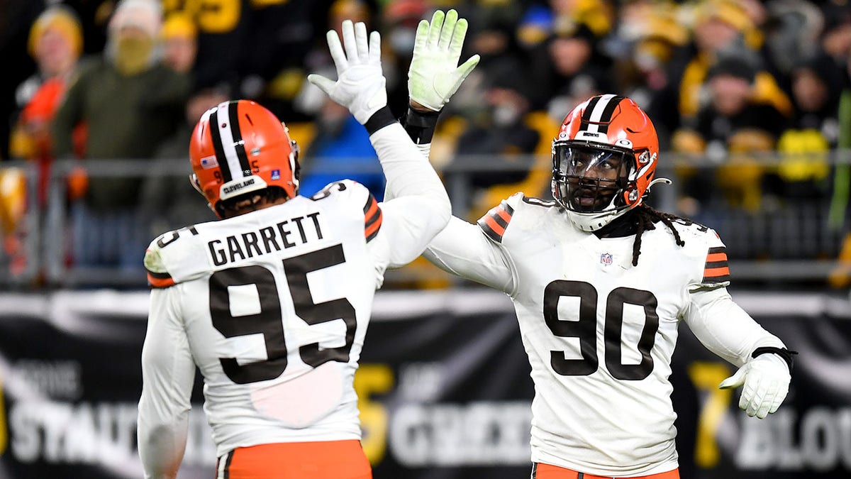 Myles Garrett and Jadeveon Clowney high five