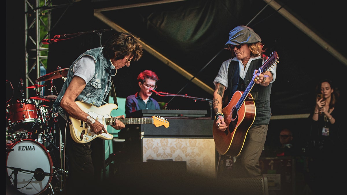 Jeff Beck and Johnny Depp play their guitars on stage in Helsinki, Finland