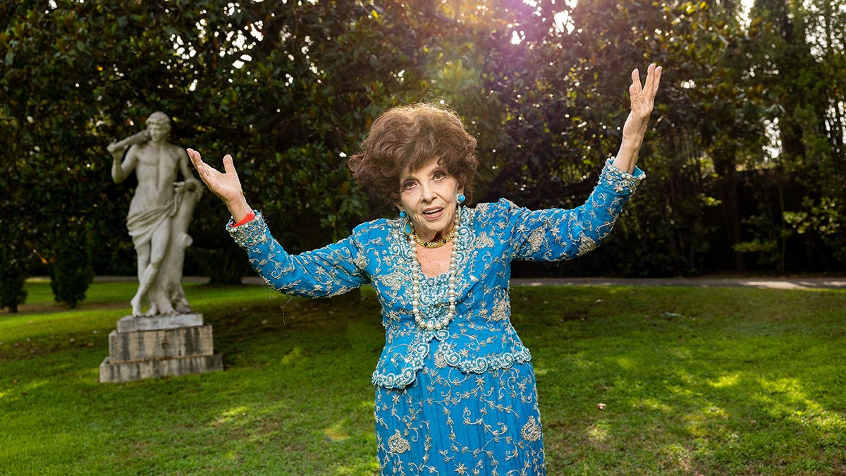 Gina Lollobrigida celebrates her 95th birthday in a bright blue outfit