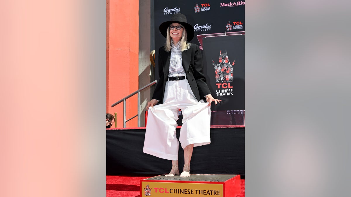 Diane Keaton stands in cement at the TCL Chinese Theatre for her Hand and Footprint ceremony