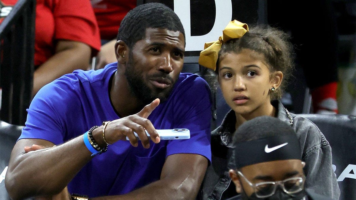 Dexter Fowler attends a WNBA game with his daughter
