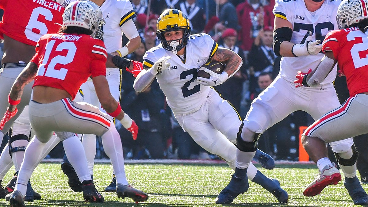 Michigan star running back has camouflage Camaro stolen God