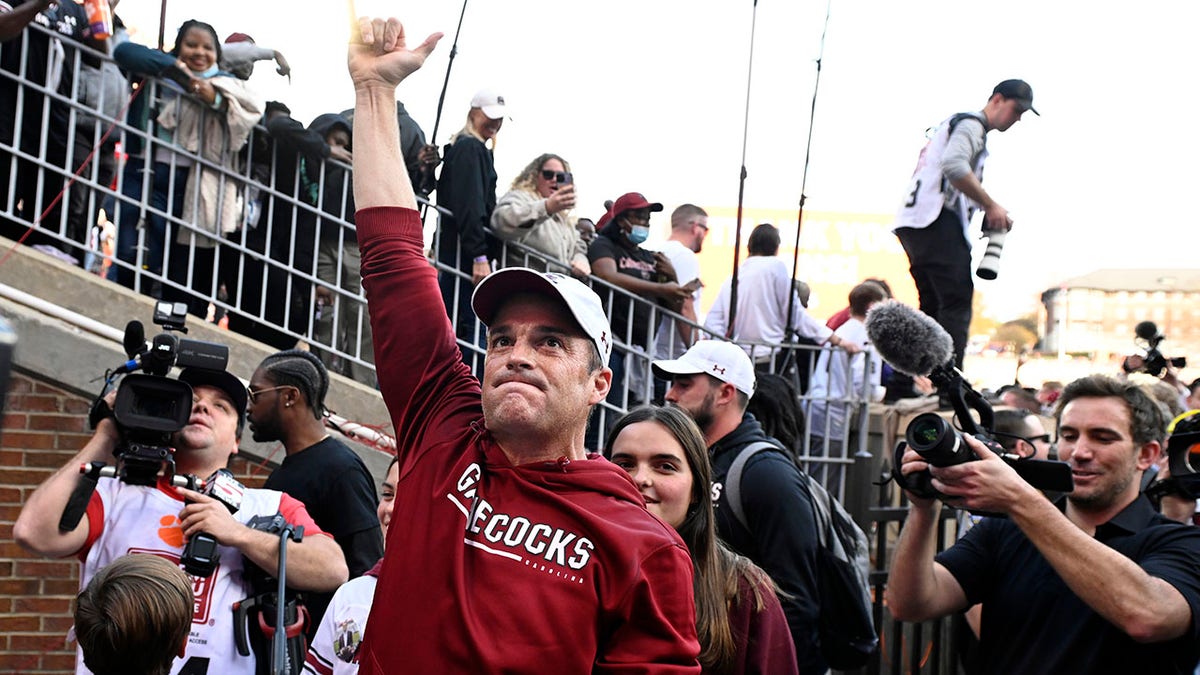 Shane Beamer celebrates after beating Clemson