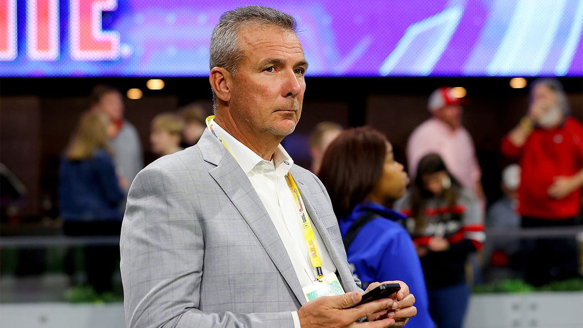 Urban Meyer watches the College Football Playoff