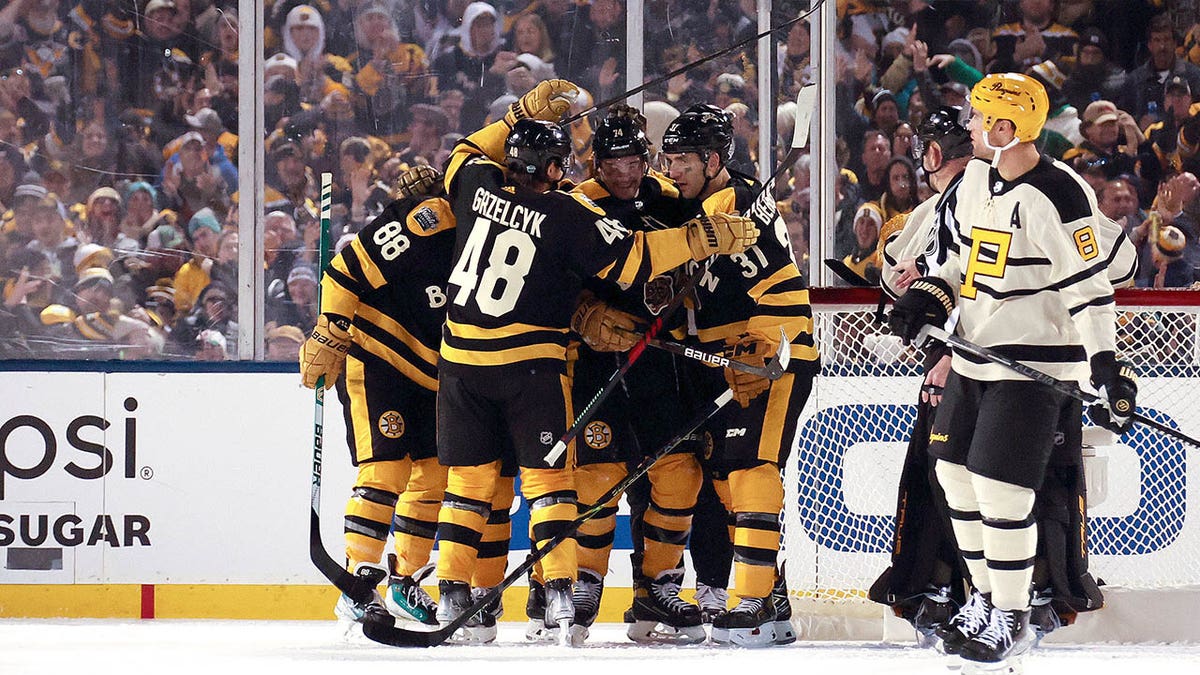 The Bruins celebrate Jake DeBrusk's goal