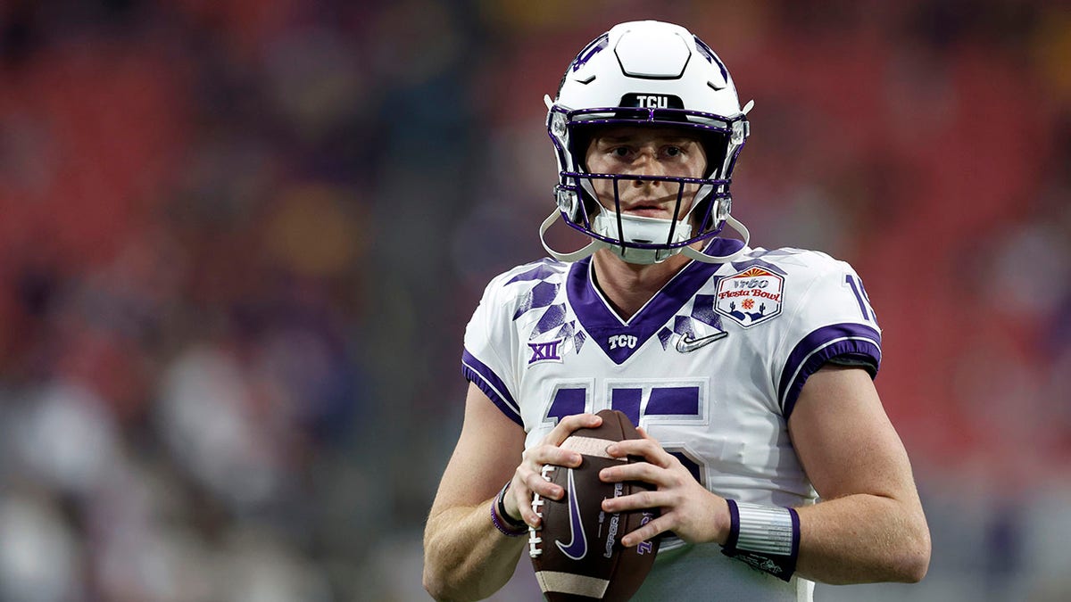 Max Duggan warms up before the game against Michigan