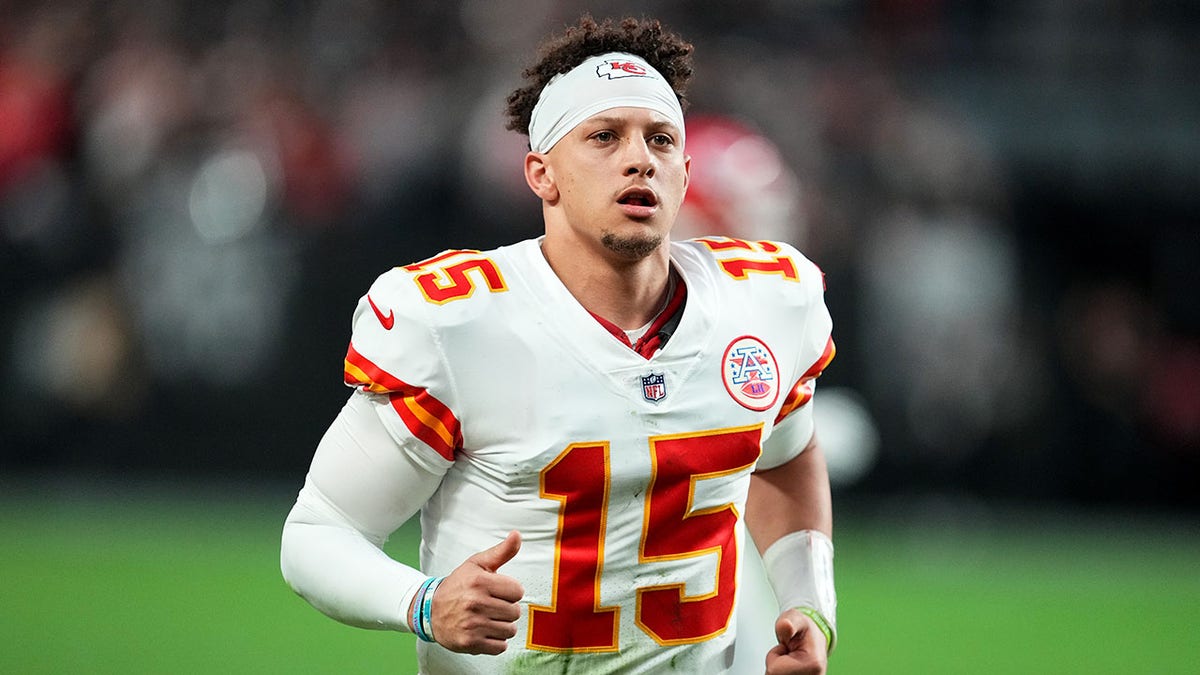 Patrick Mahomes runs onto the field against the Raiders