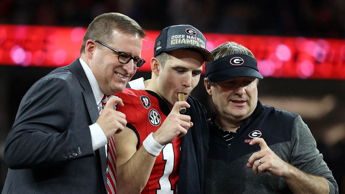 Josh Brooks, head coach Kirby Smart and Stetson Bennet at the National Championship game in 2023