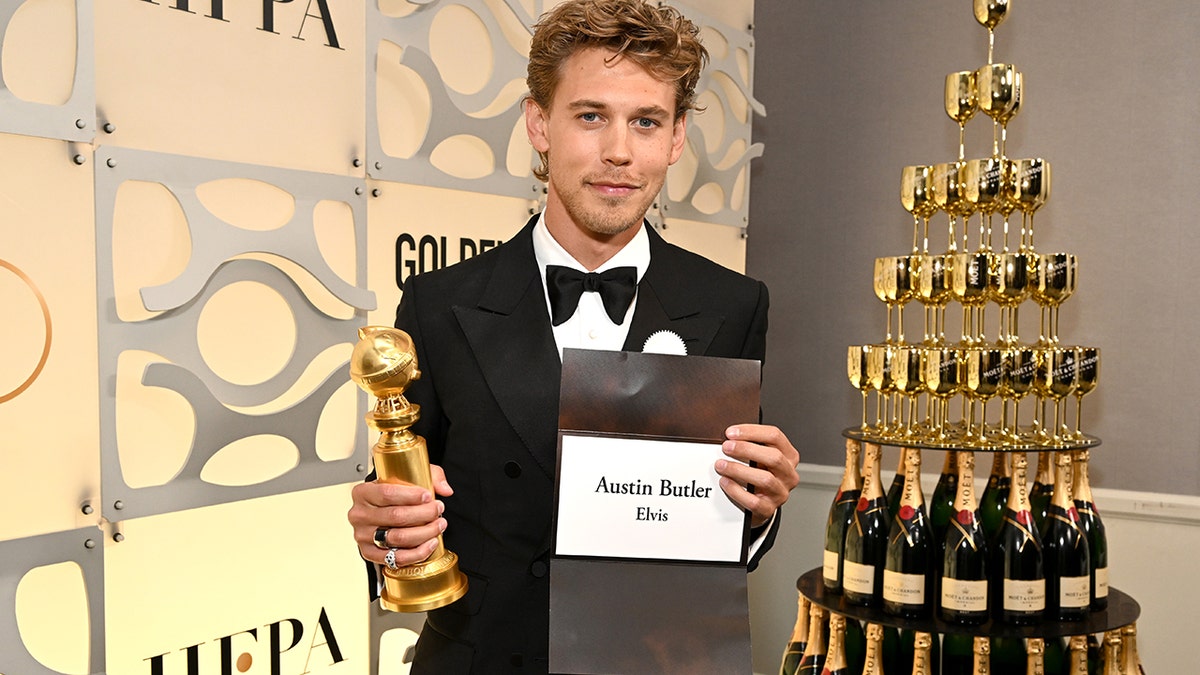 Austin Butler with an award