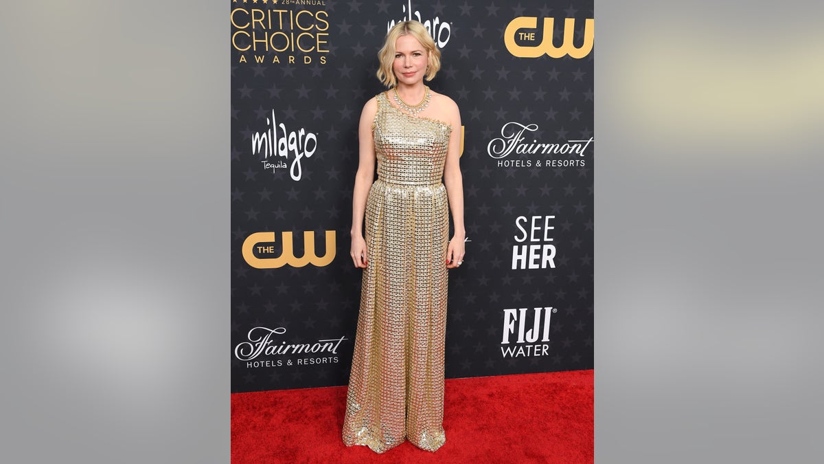 Michelle Williams poses on the red carpet at the 2023 Critic's Choice Awards 