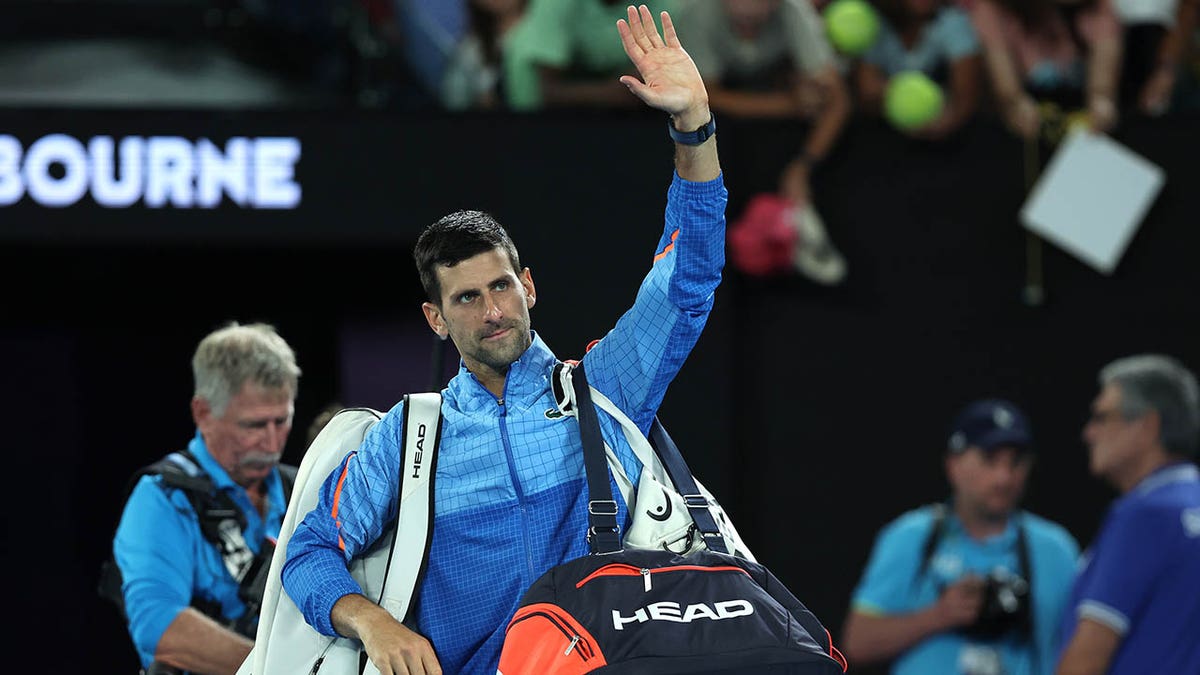 Novak Djokovic celebrates after winning his fourth round match at the Australian Open