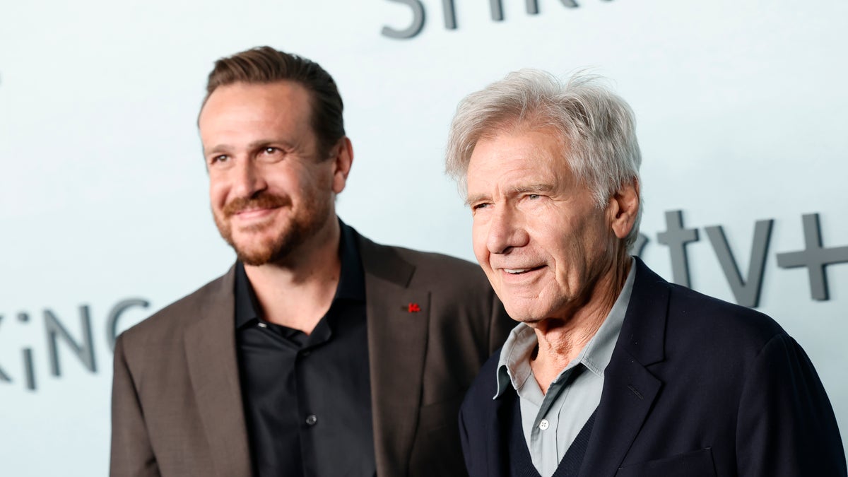Jason Segel and Harrison Ford smile together at the premiere of their show "Shrinking"