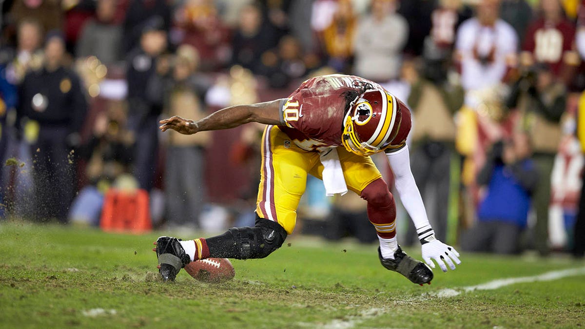 Robert Griffin III suffers a knee injury in a playoff game against the Seahawks