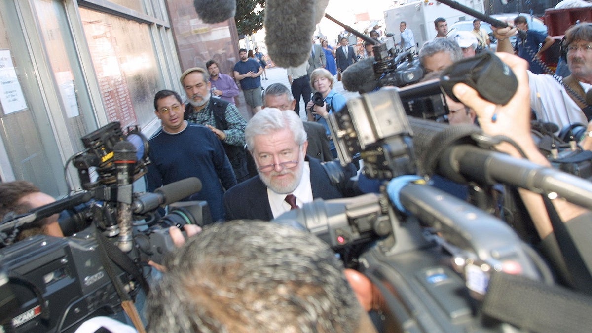 george parnham surrounded by cameras