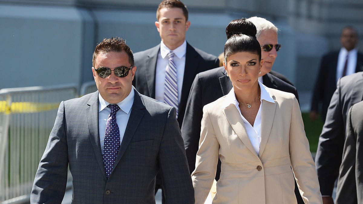 Teresa Guidice and her then-husband Giuseppe Guidice leaving court in 2013