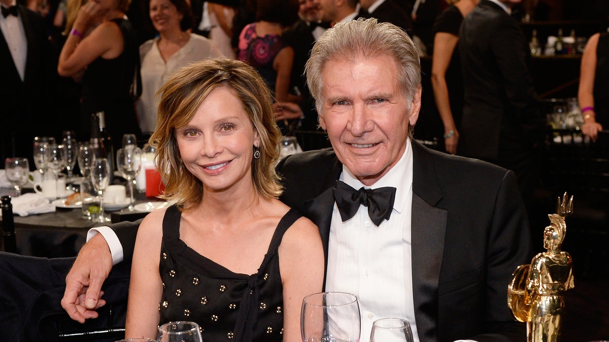 Calista Flockhart and Harrison Ford pose together at the 2015 Jaguar Land Rover British Academy Britannia Awards presented by American Airlines at The Beverly Hilton Hotel