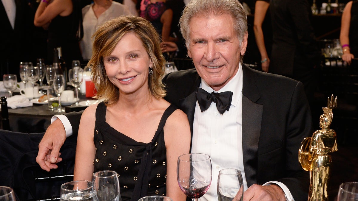 Calista Flockhart and Harrison Ford pose together at the 2015 Jaguar Land Rover British Academy Britannia Awards presented by American Airlines at The Beverly Hilton Hotel