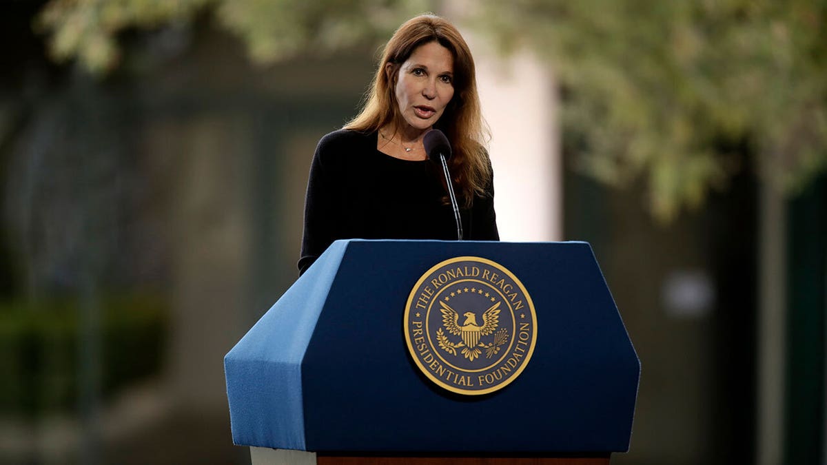 Patti Davis speaks at the podium at the funeral of her mother Nancy Reagan in Simi Valley, California