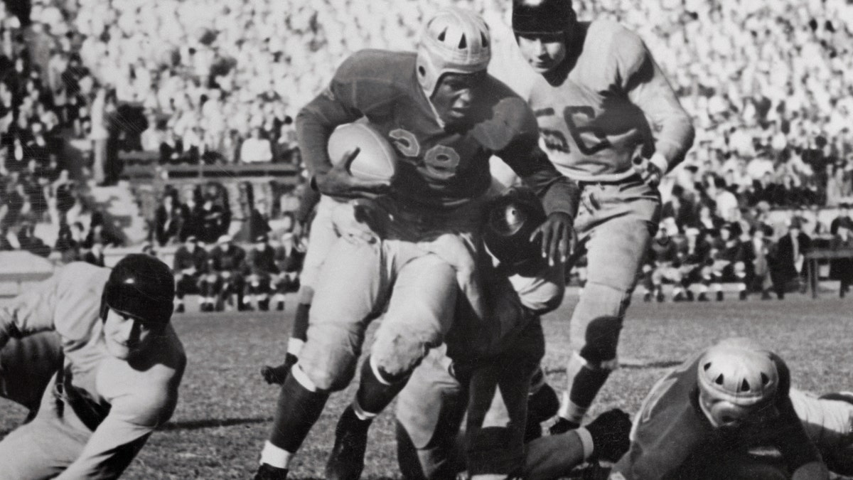 Jackie Robinson playing football