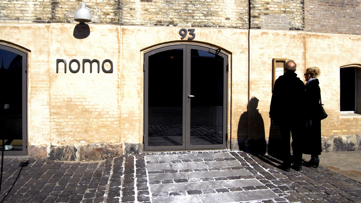 Visitors taking photos at Noma restaurant in Copenhagen, Denmark.