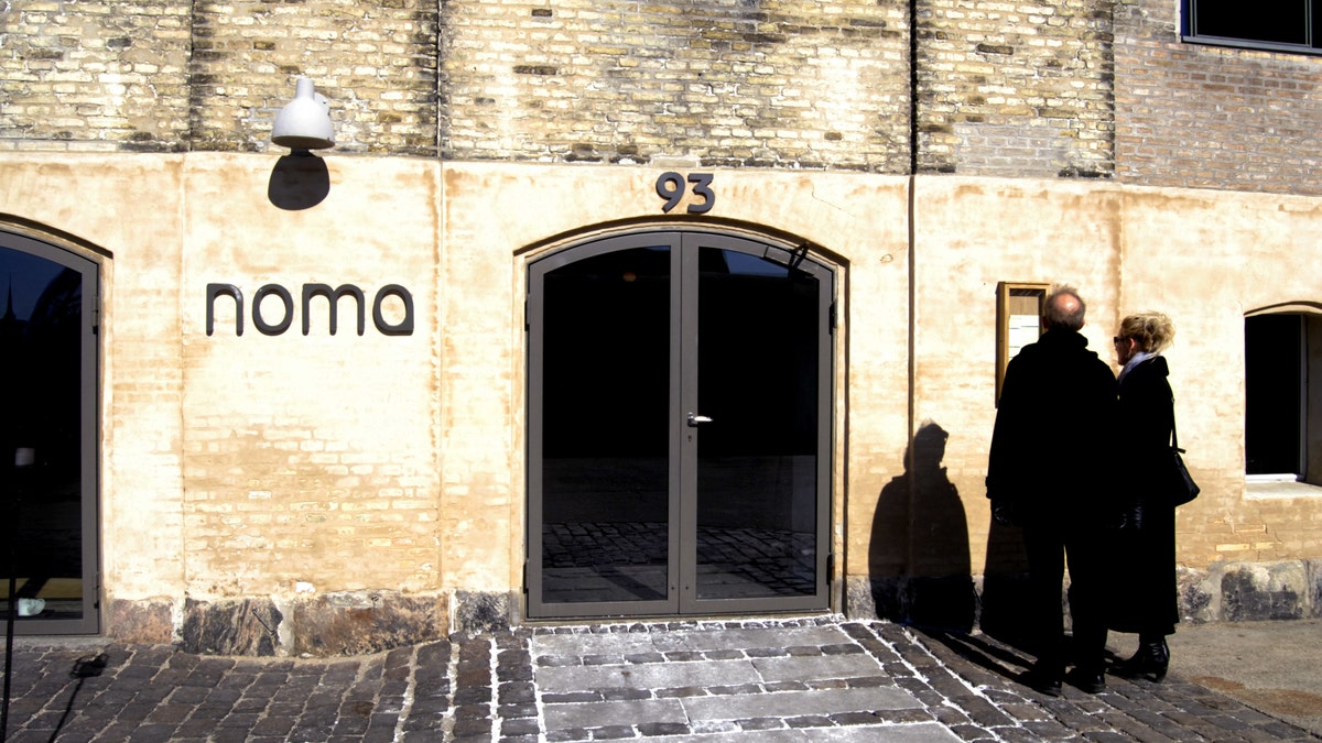 Visitors taking photos at Noma restaurant in Copenhagen, Denmark.