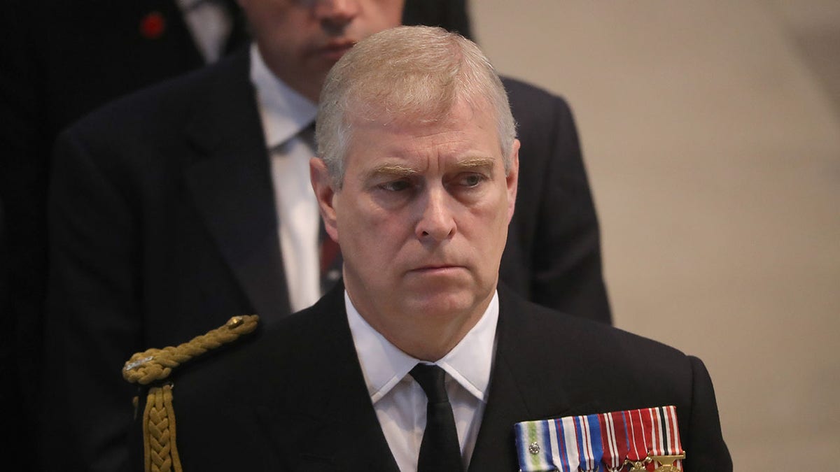 prince andrew scowls