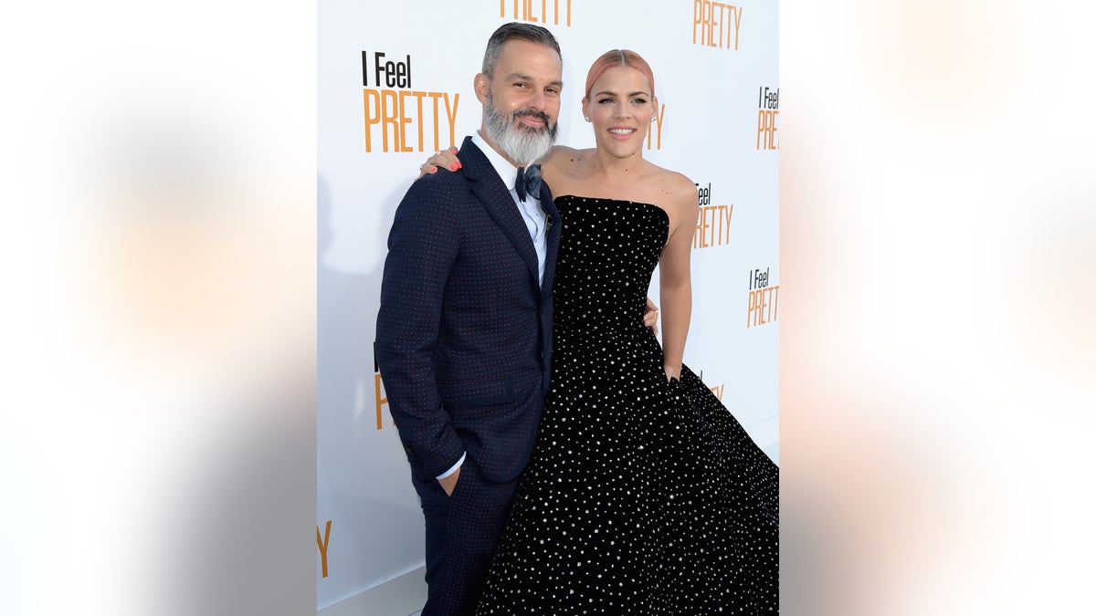Busy Philipps and Marc Silverstein pose together at the premiere of "I Feel Pretty"