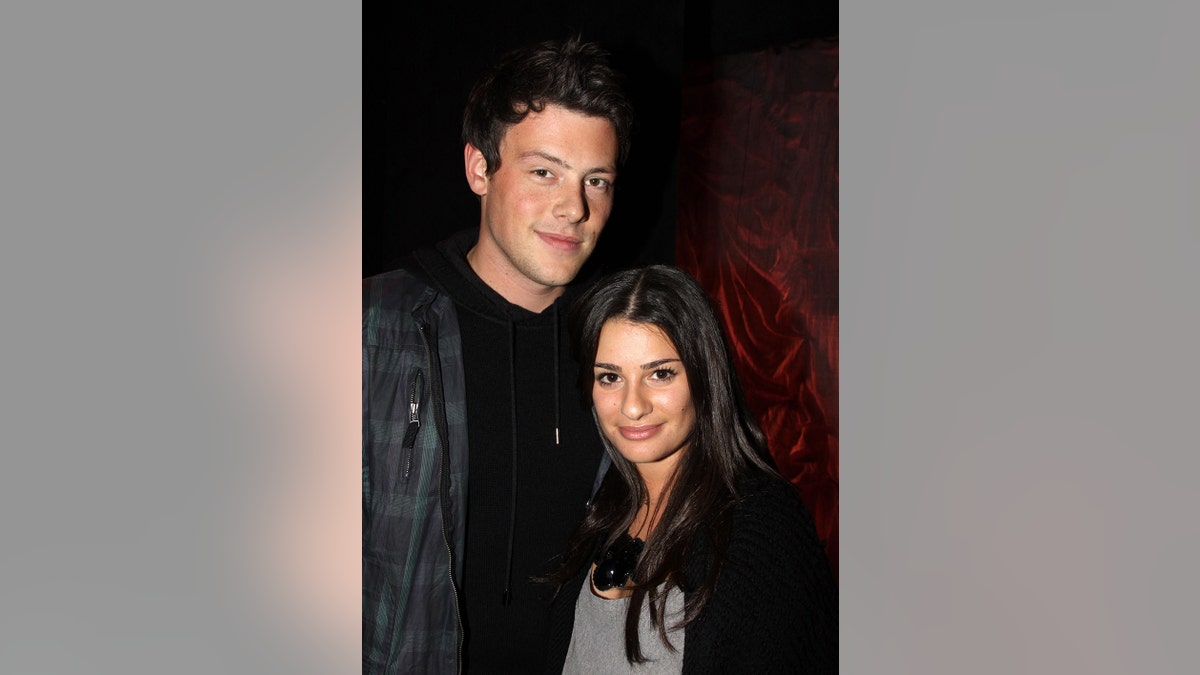 Cory Monteith and Lea Michele pose backstage at "Love, Loss and What I Wore"