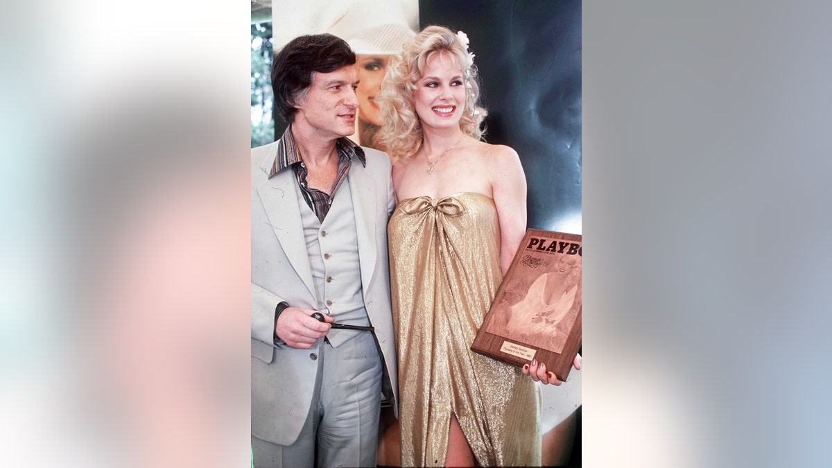 Hugh Hefner posing with Playboy Playmate Dorothy Stratten