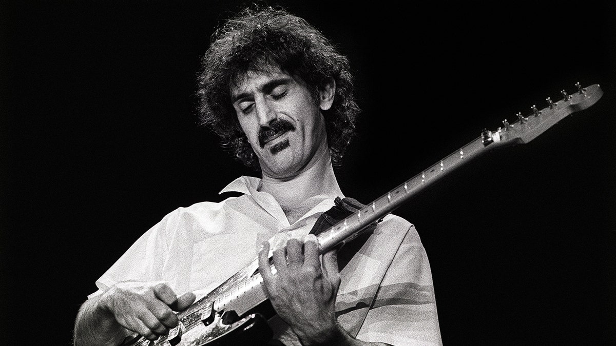 Frank Zappa playing guitar