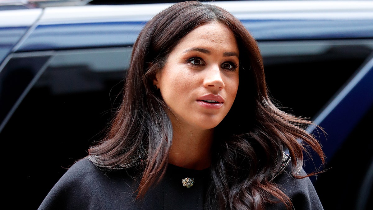 Meghan Markle looking serious during a royal engagement