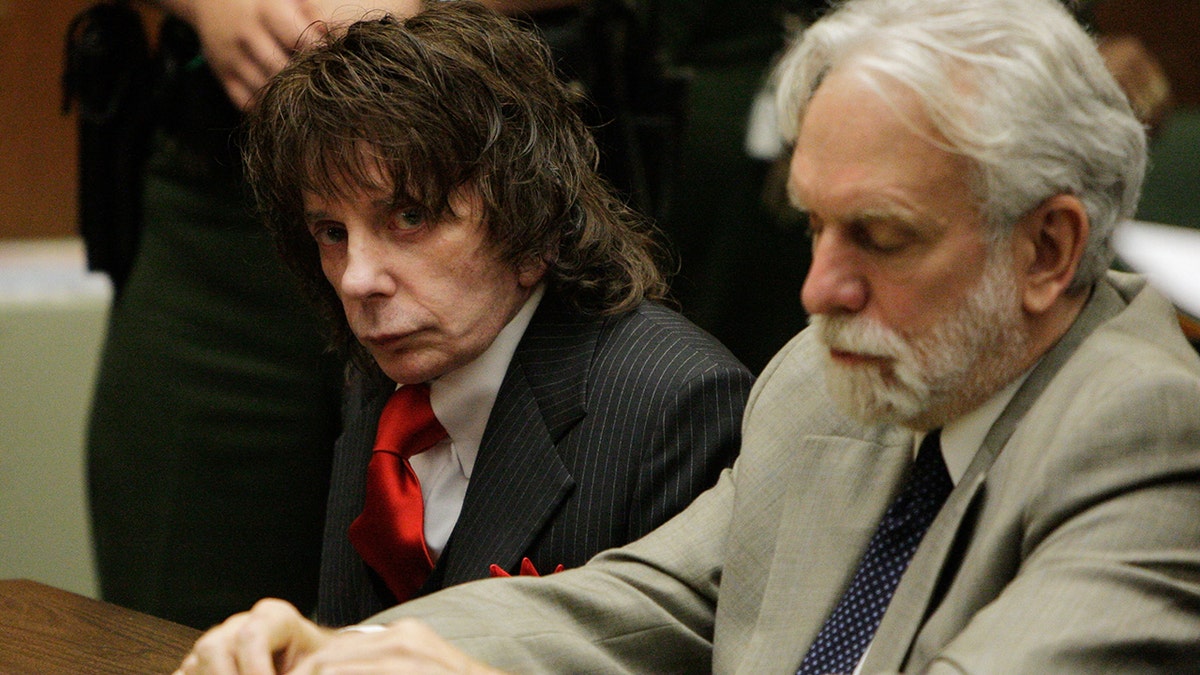 Phil Spector (L) listens to the judge during sentencing in Los Angeles Criminal Courts