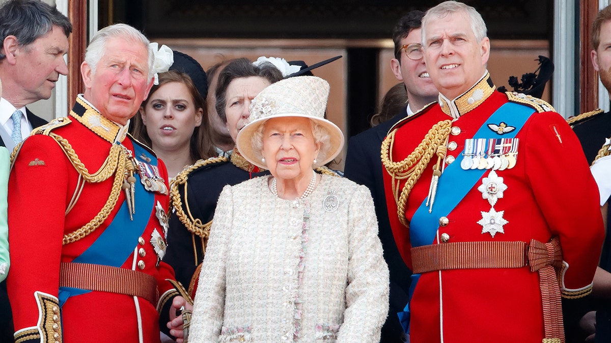 Prince Charles, Prince of Wales, Queen Elizabeth II and Prince Andrew, Duke of York watch a flypast from the balcony of Buckingham Palace during Trooping The Colour, the Queen's annual birthday parade,