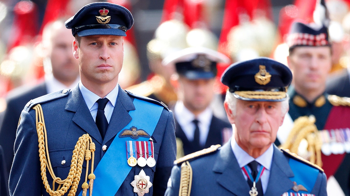 Prince William and King Charles III looking stern