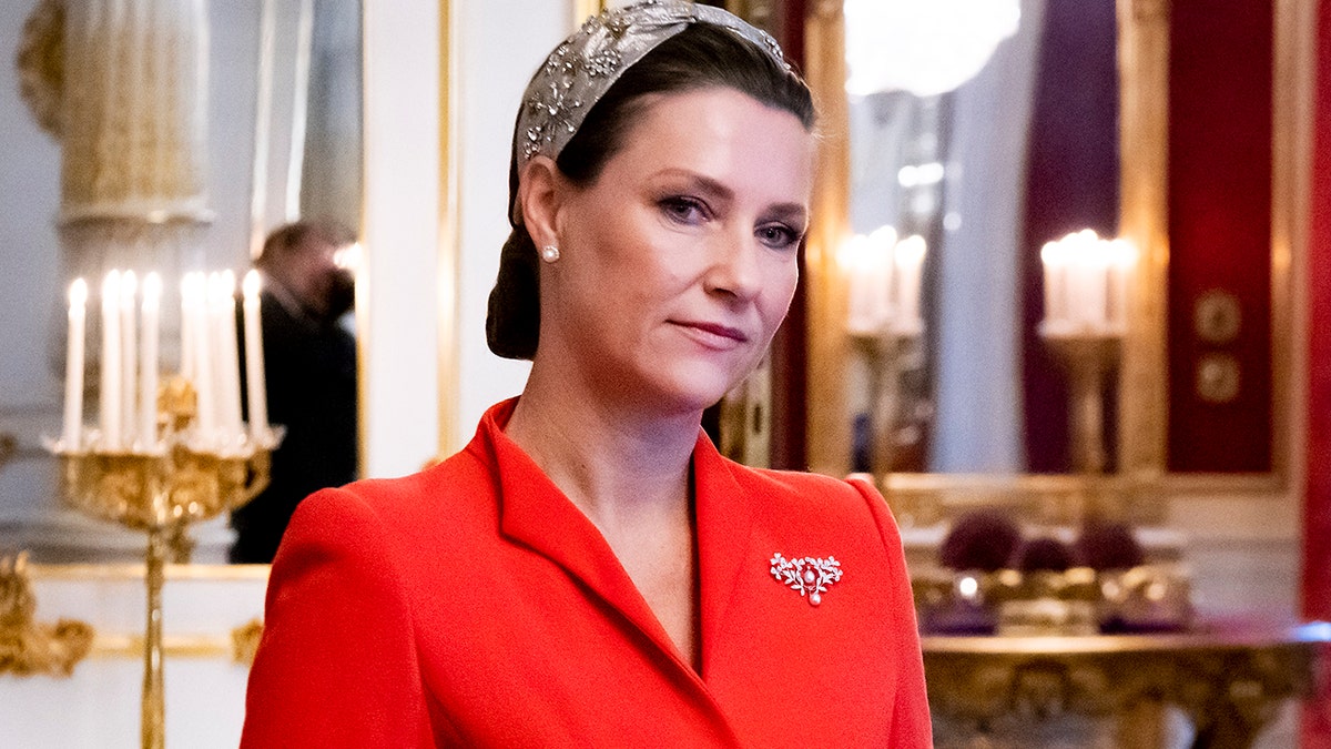 Princess Martha Louise of Norway at the palace wearing red