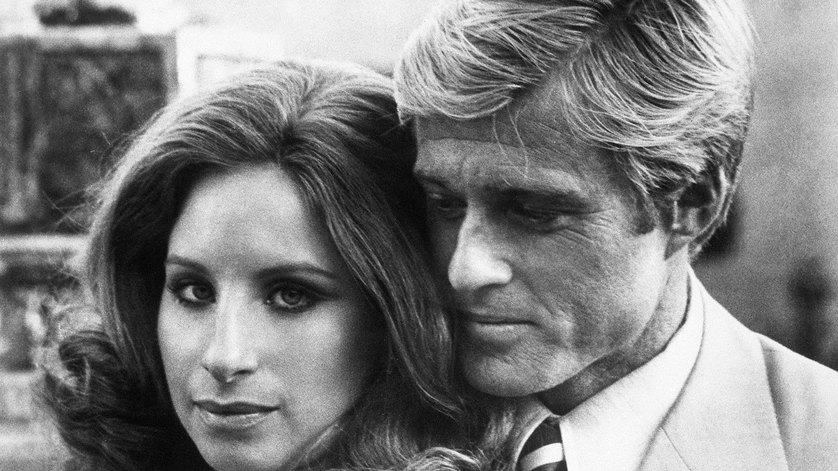 Robert Redford embracing Barbra Streisand in The Way We Were