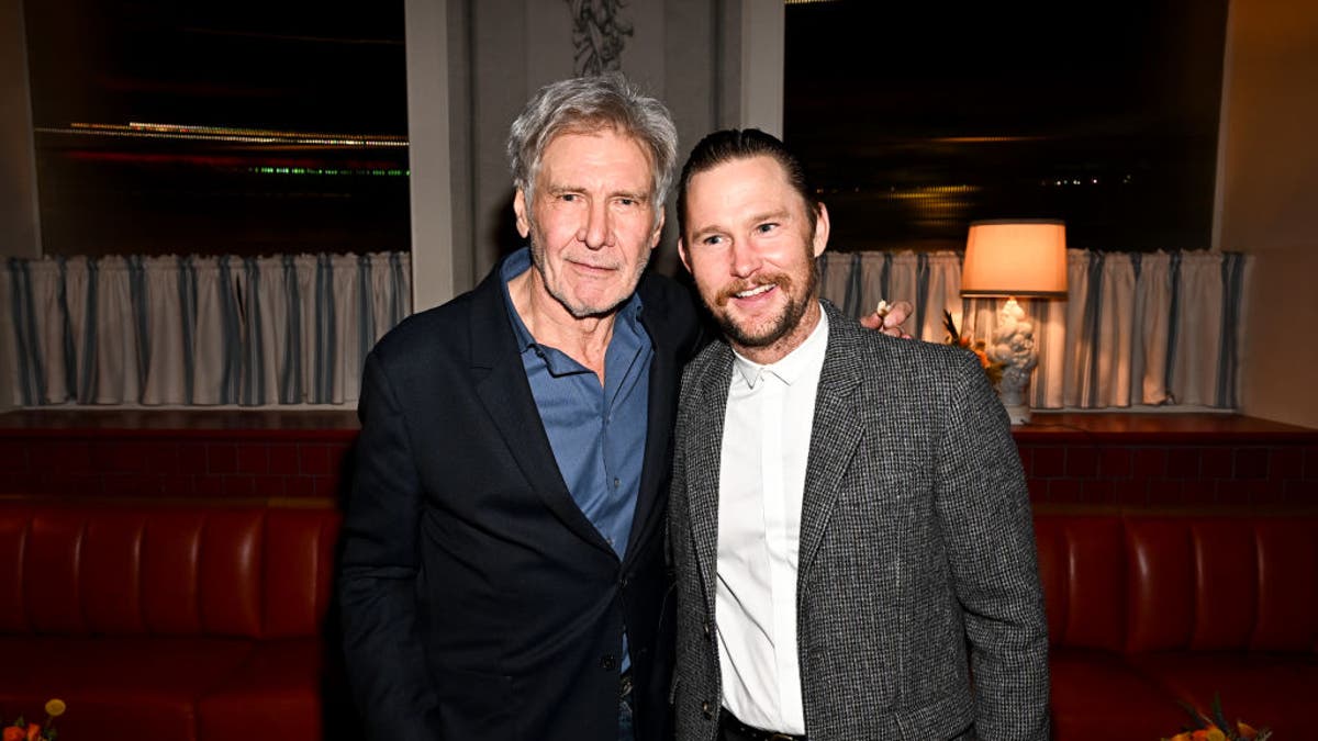 Harrison Ford and Brian Geraghty pose for a photo