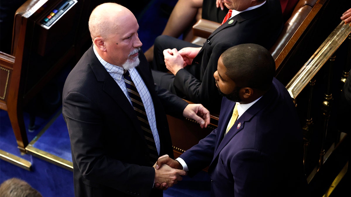 Rep.-elect Chip Roy, R-Texas, shakes hands with Rep.-elect Byron Donalds, R-Fla.,