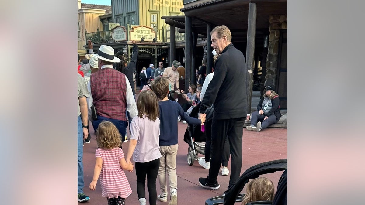 Marie Osmond shared a photo of her husband Steve Craig walking with their grandchildren at Disney World