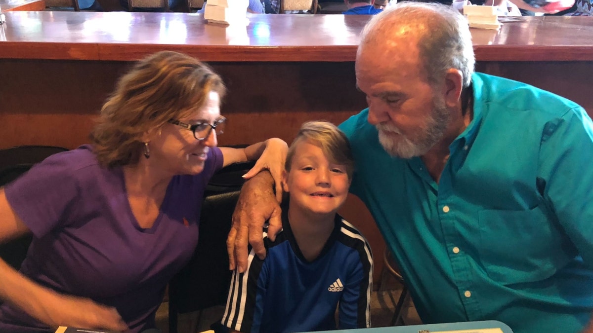 Kay and Larry Woodcock with their grandson, J.J. Vallow