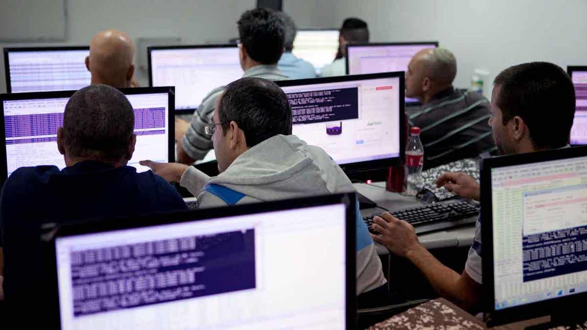 Israelis working on a computer