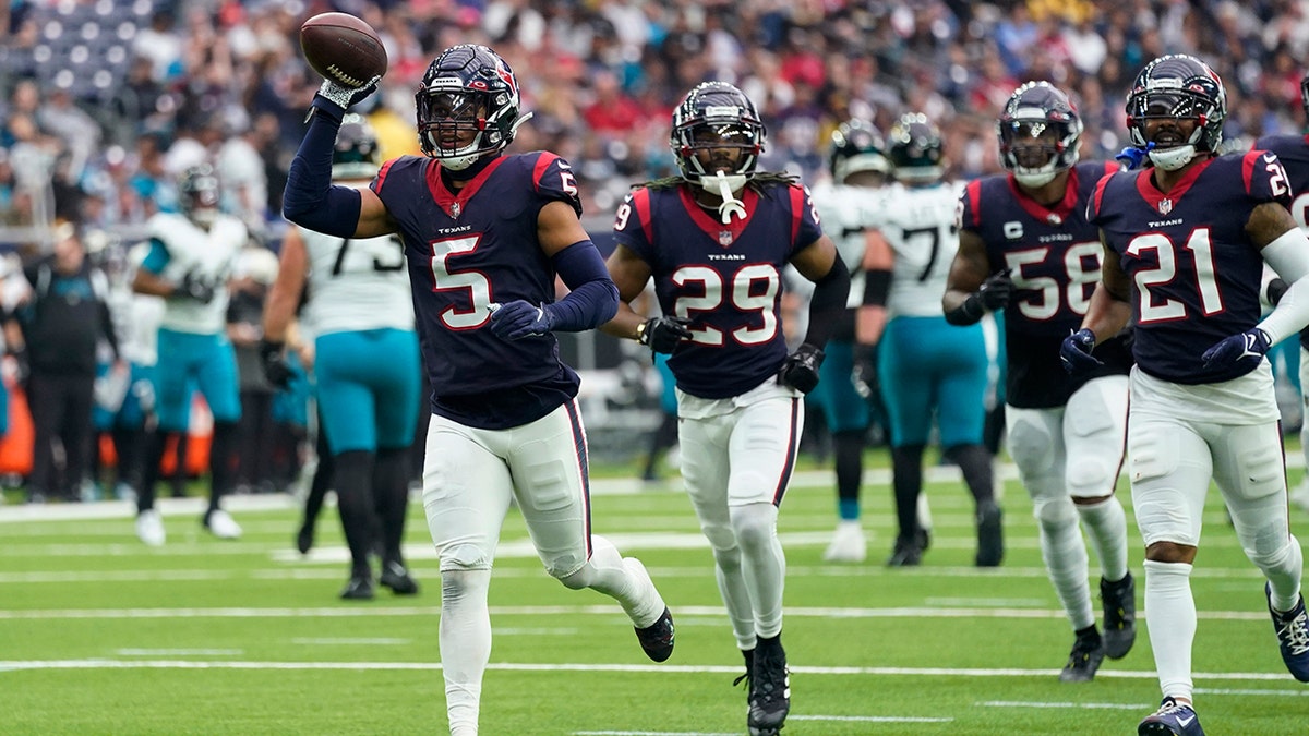 Jalen Pitre celebrates an interception