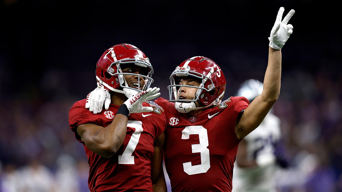 Ja'Corey Brooks of the Alabama Crimson Tide with Jermaine Burton