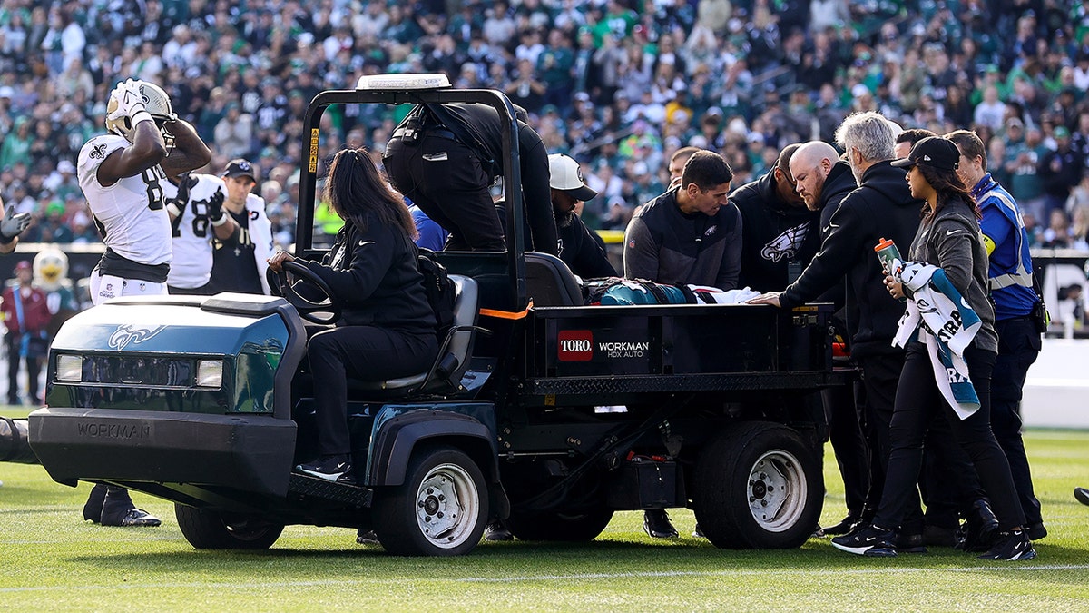 Josh Sweat being carted off