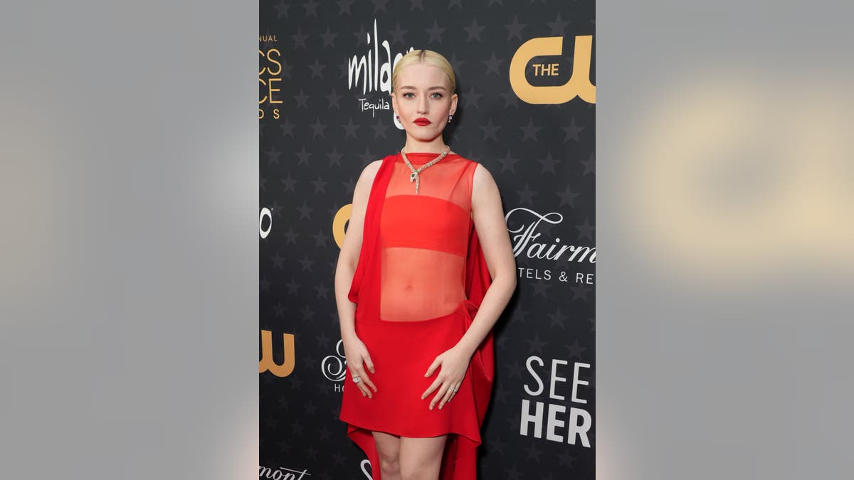 Julia Garner wears fiery red two-piece dress
