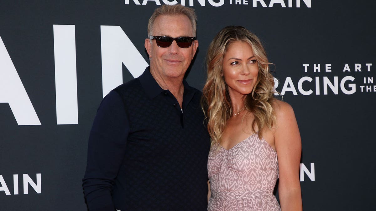 Kevin Costner and his wife Christine Baumgartner at film premiere
