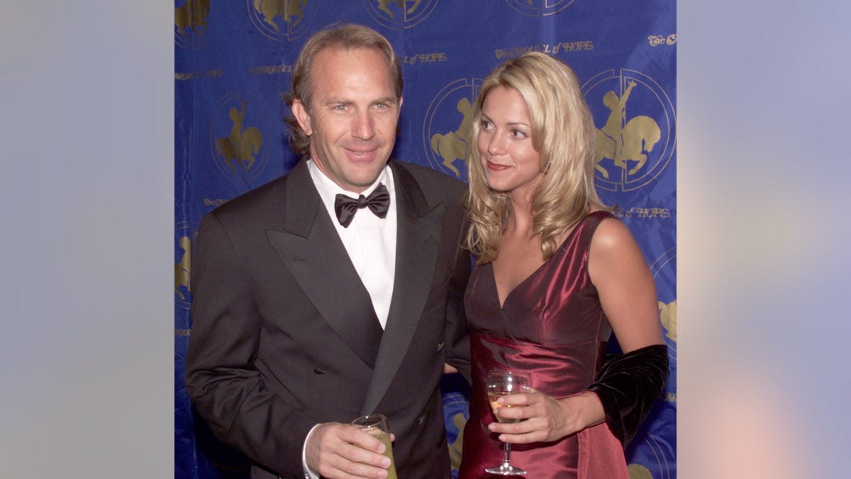 Kevin Costner and wife attend a premiere