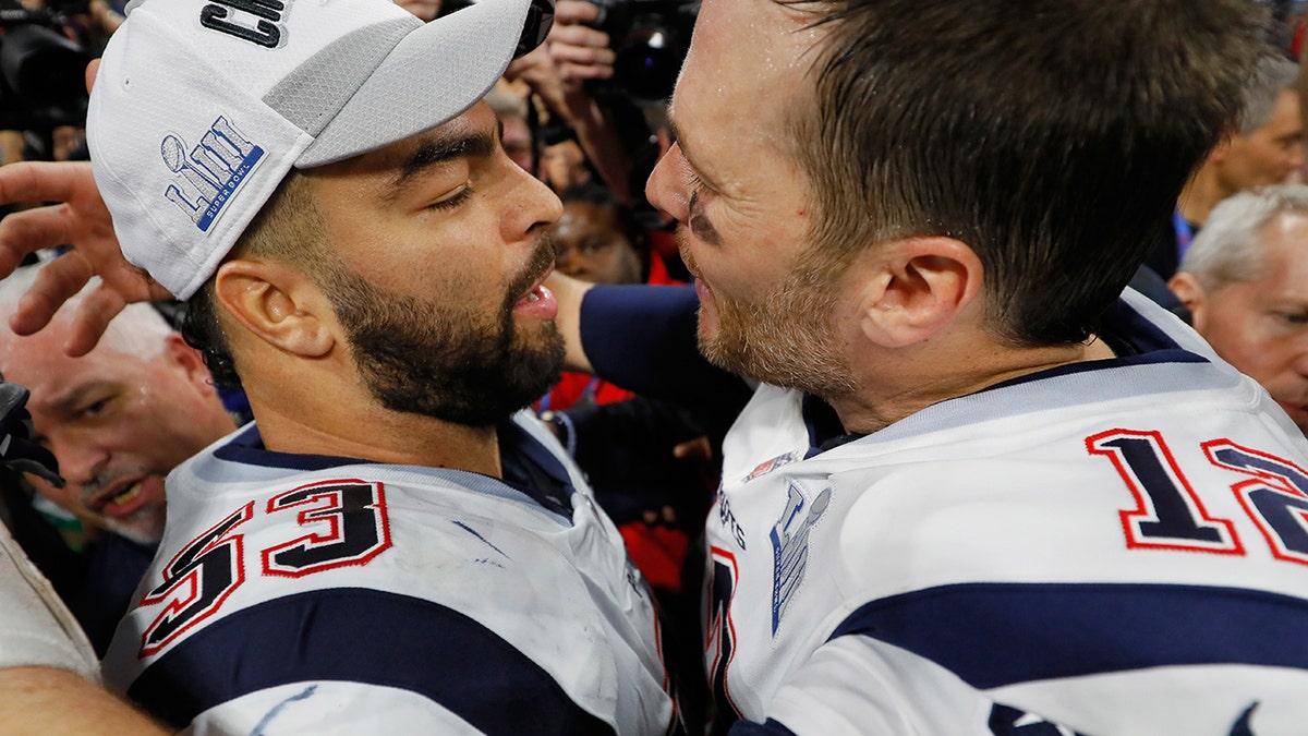 Kyle Van Noy embraces Tom Brady