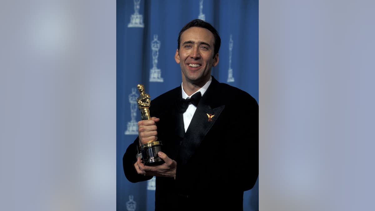 Oscar winner Nic Cage shows off his trophy