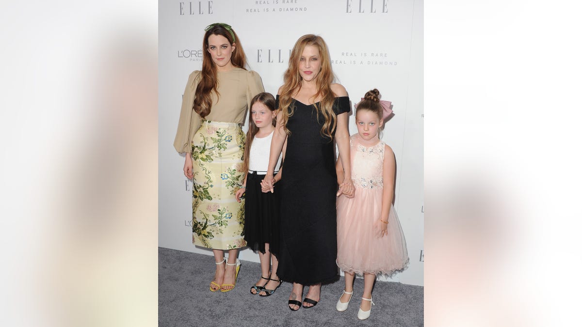 Lisa Marie Presley on red carpet with daughters